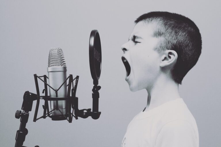jason-rosewell-ASKeuOZqhYU-unsplash Boy yelling into mic