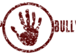 A sign saying "Stop Bullying: with an image of the palm of a hand